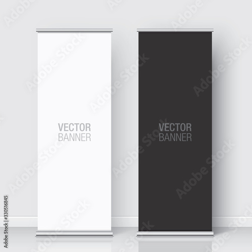 Set of black and white vector rollup banners standing on a white wall background. Vertical banner realistic mockups.
