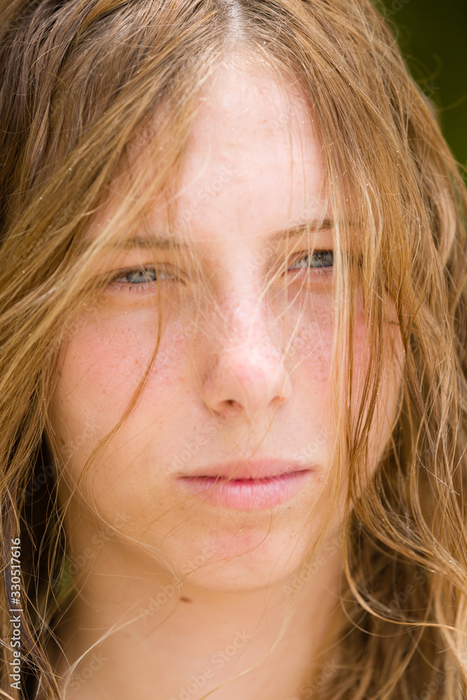 Portrait of a young, beautiful blonde teenager girl face close-up. Portrait of a young, beautiful blonde teenager girl face close-up.