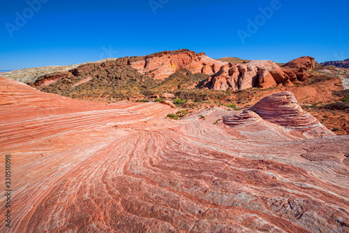 Red coloured rock layers at small wave in Valley of Fire, USA