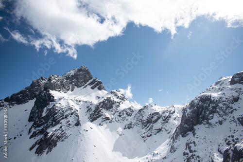Close up of snow mountain with bright blue sky
