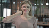 Portrait Shoot of Cheerful Woman showing Thumbs Up