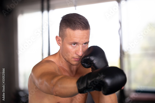 young man with boxing gloves © FotoArtist