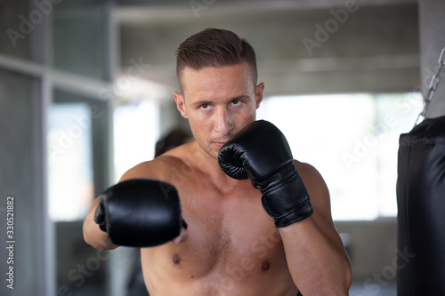 young man with boxing gloves © FotoArtist