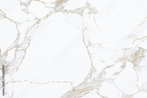 White marble stone texture with golden cracks pattern, close up background.