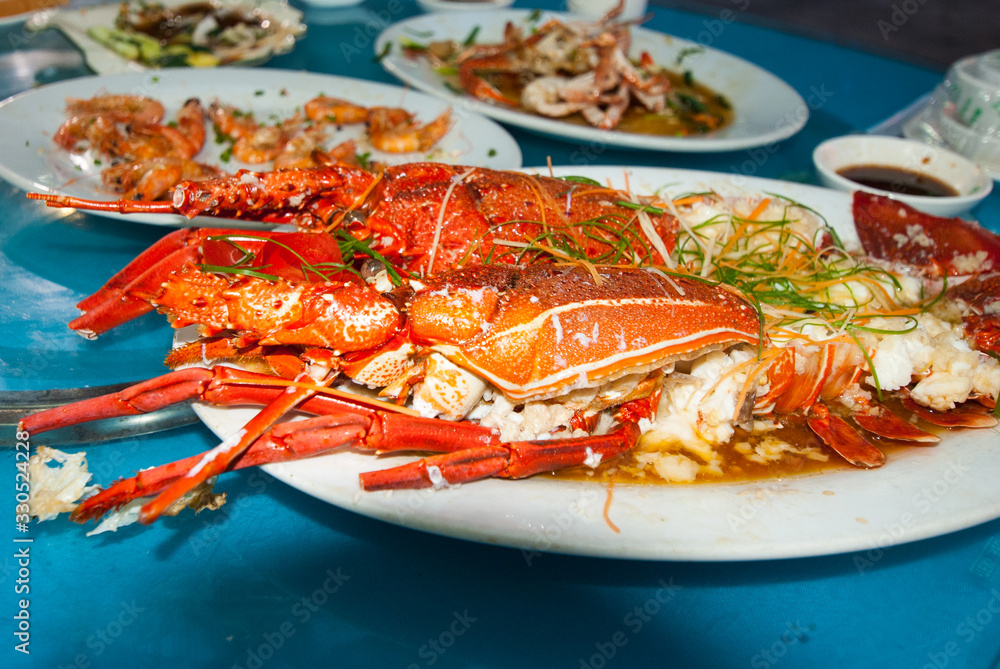 Lobsters cooked with spices and herbs on a plate Lobsters cooked with spices and herbs on a plate