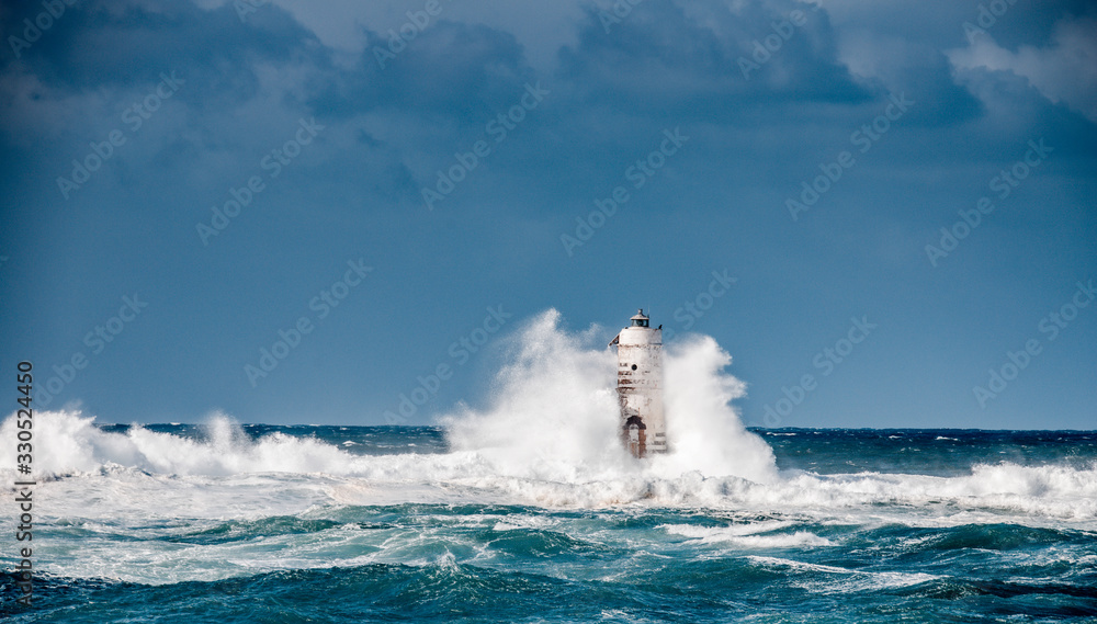 Fototapeta premium ligthouse storm mangiabarche calasetta sardinia