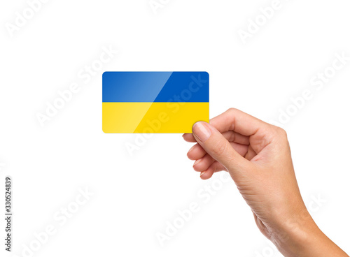 Beautiful hand holding Ukraine flag card on white background
