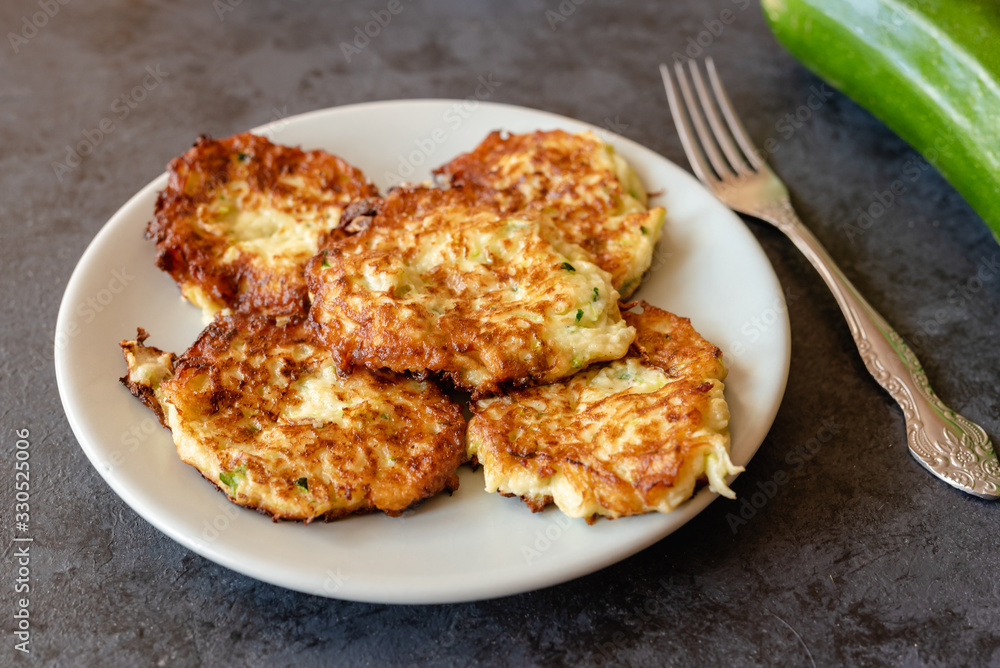 Crispy zucchini fritters with egg, flour and onion. Crispy zucchini fritters with egg, flour and onion.