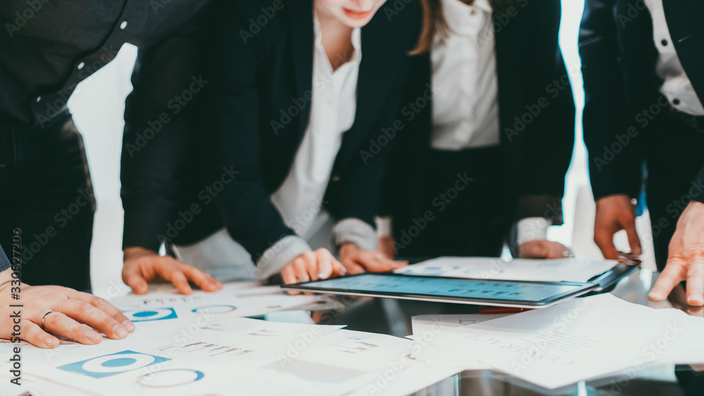 Fototapeta premium Project management. Cropped shot of business partners working with graphs and charts.