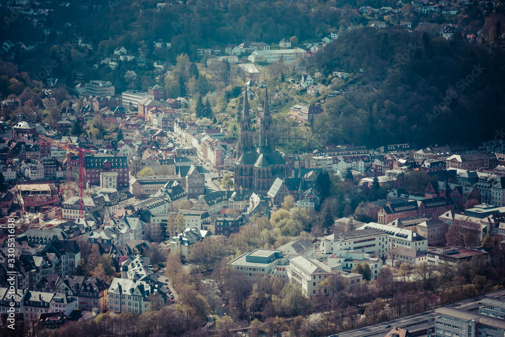 Marburg. Germany. The new and the old part of the city from the surrounding hills. Toning. Stylization. Marburg is a university town in the German federal state (Bundesland) of Hessen.