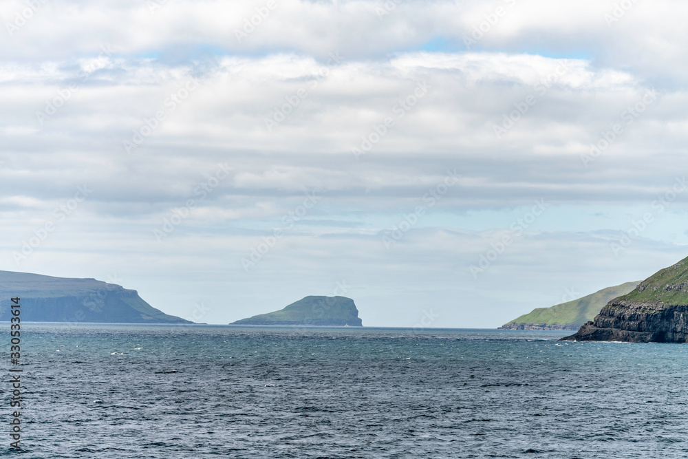 View towards Skopunarfjordur near Kirkjubour in the Faroe Islands on Streymoy island as seen from Smyril ship to Suderoy