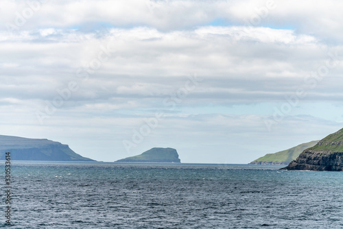 View towards Skopunarfjordur near Kirkjubour in the Faroe Islands on Streymoy island as seen from Smyril ship to Suderoy © Fons