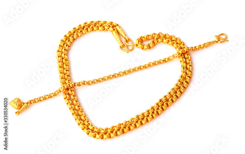 Heart shaped gold necklace on a white background.