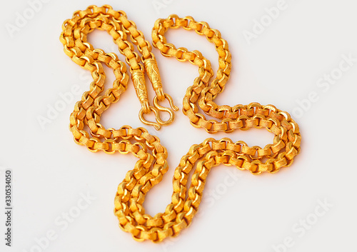 Gold necklace isolated on a white background.