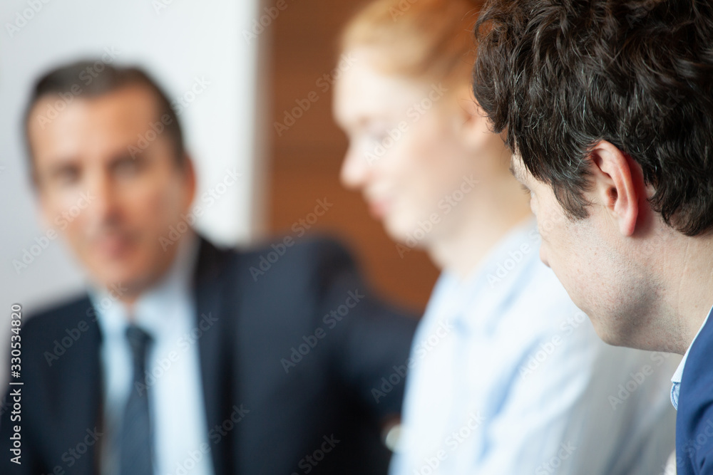 Business people sitting in a row Business people sitting in a row
