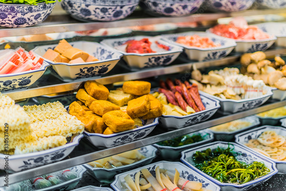 Traditional Asian food ingredients and dishes sold in a singapore restaurant