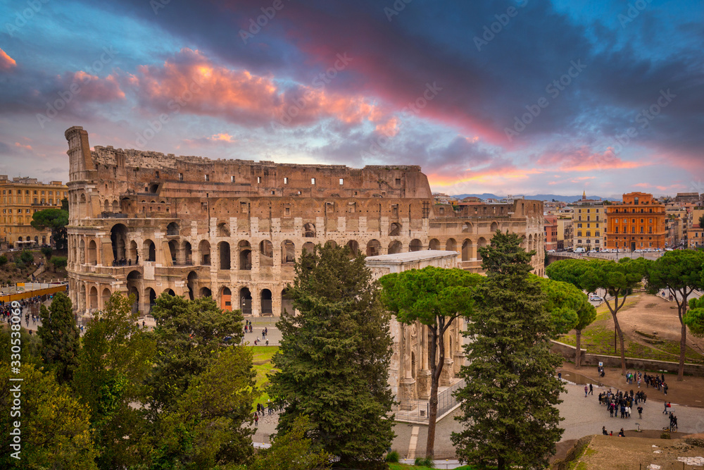 The Colosseum in Rome at sunrise, Italy