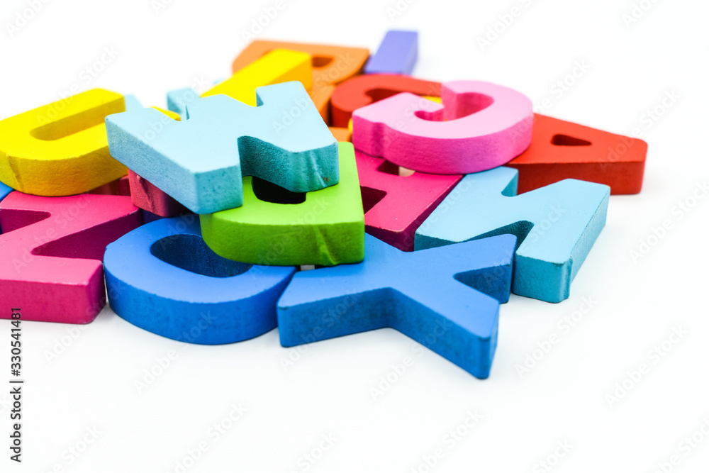 Colourful wooden alphabet letters isolated on white background Colourful wooden alphabet letters isolated on white background