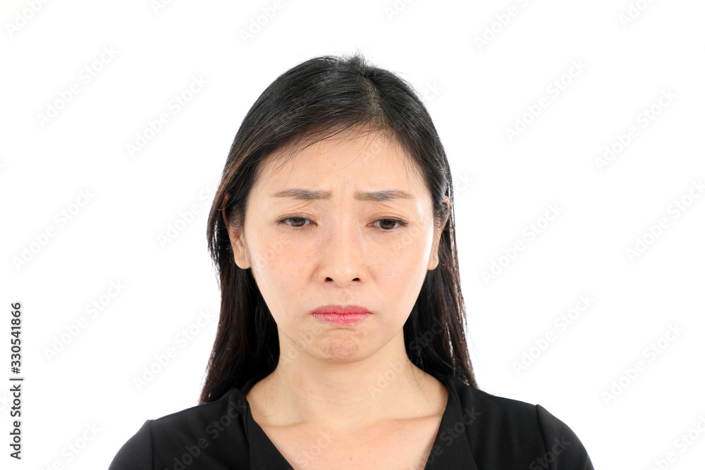 Facial Expression mid aged asian woman office attire white background sad unhappy