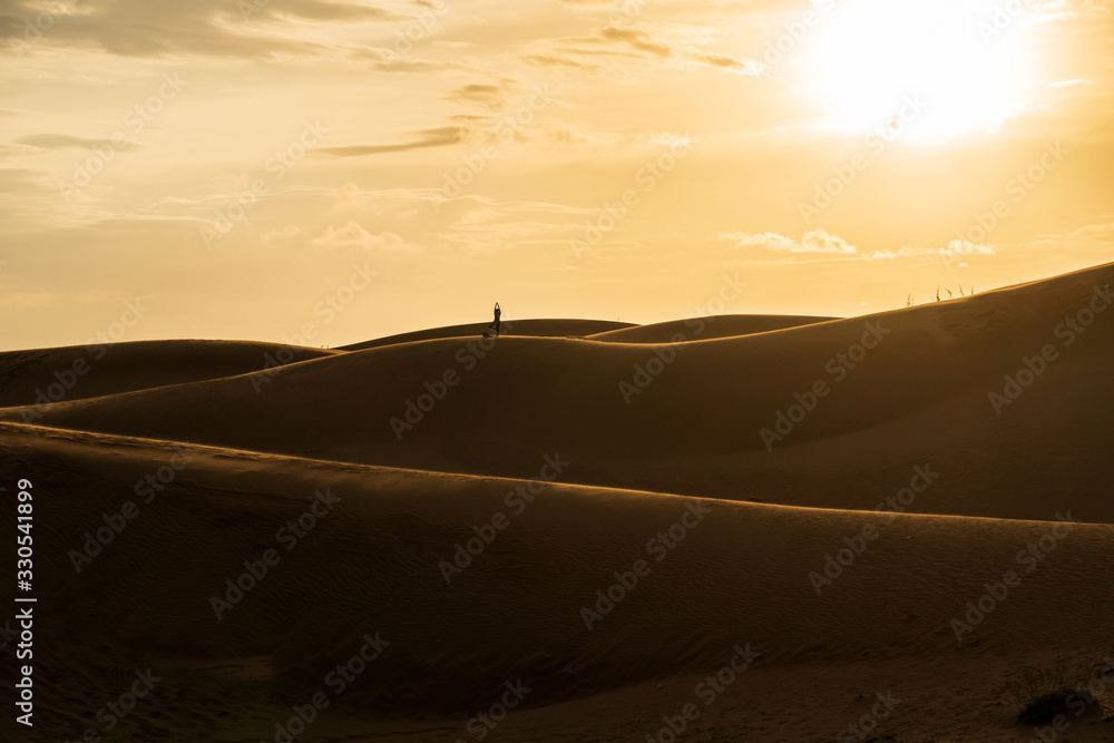 Beautiful sand dunes in red sand dune desert, Muine Vietnam, at sunrise