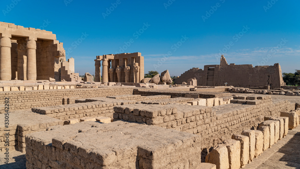 The Ramesseum is the memorial temple or mortuary temple of Pharaoh Ramesses II. It is located in the Theban necropolis in Upper Egypt, across the River Nile from the modern city of Luxor. Egypt. The Ramesseum is the memorial temple or mortuary temple of Pharaoh Ramesses II. It is located in the Theban necropolis in Upper Egypt, across the River Nile from the modern city of Luxor. Egypt.