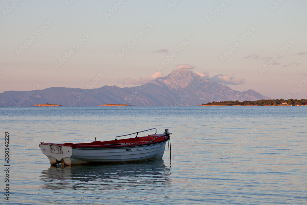 Mont Athos Greece with fishing boat at foreground