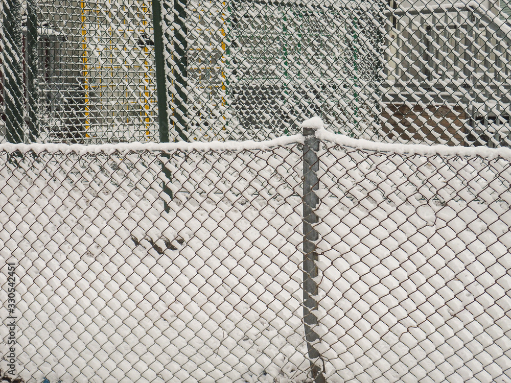 snow covered metal fences snow covered metal fences