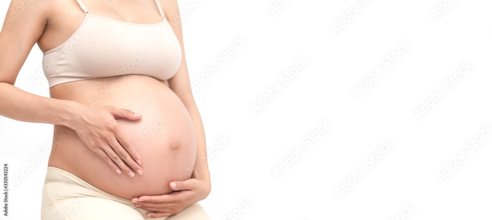 Close up of pregnant belly. Pensive pregnant woman dreaming about child. Young happy expectant thinking about her baby and enjoying her future life. Close up of pregnant belly. Pensive pregnant woman dreaming about child. Young happy expectant thinking about her baby and enjoying her future life.