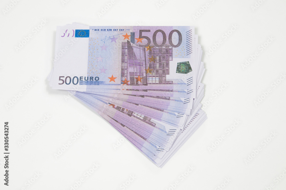 a stack of five hundred Euro notes on a white background is spread out like a fan top view a stack of five hundred Euro notes on a white background is spread out like a fan top view