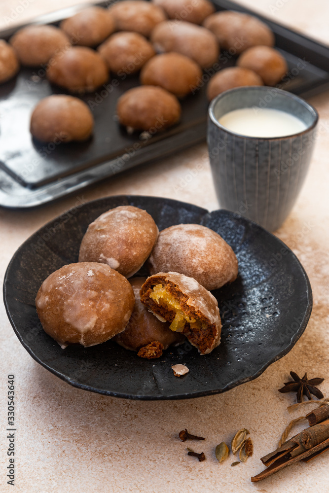 traditional Russian honey cake or gingerbread called pryanik. Spice cake with fruit jam and honey filling authentic Russian dessert. Homemade sweet pastries on a baking sheet. traditional Russian honey cake or gingerbread called pryanik. Spice cake with fruit jam and honey filling authentic Russian dessert. Homemade sweet pastries on a baking sheet.
