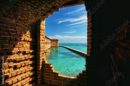 Fotografia, Obraz Looking out a window of the fort in Dry Tortugas National Park