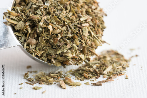 Dried Organo Spilled from a Teaspoon