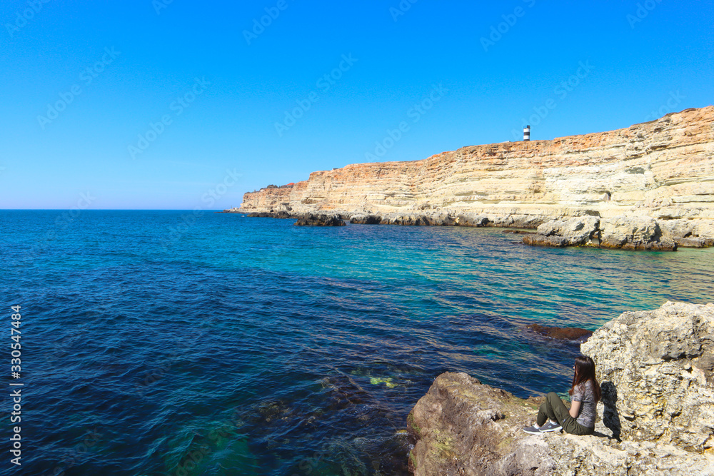  Beautiful blue bay, waves, lighthouse, girl,coastline