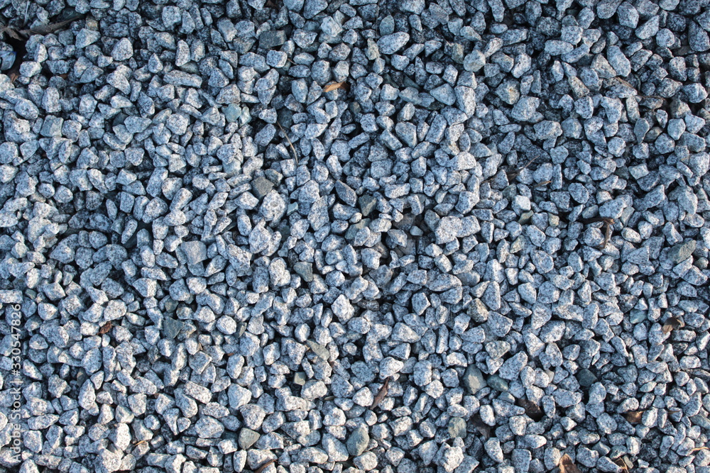 Pebbles closeup. Small stones. There is a place for text, copy space. Background, postcard. Pebbles closeup. Small stones. There is a place for text, copy space. Background, postcard.