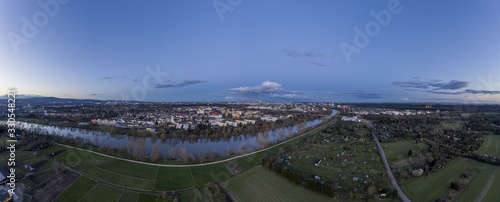 Aerial panoramic picture of river Main and the Frankfurt skyline during sunset in winter