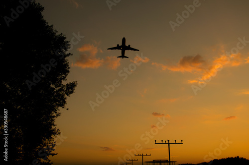 Starting Airplane at the Airport Dortmund in Germany in the sunset