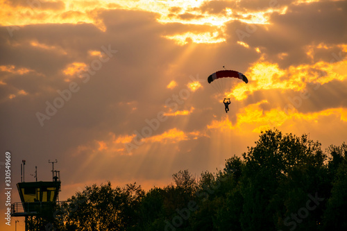 Parachutist at the airfield Soest in Sauerland Germany at sunset photo