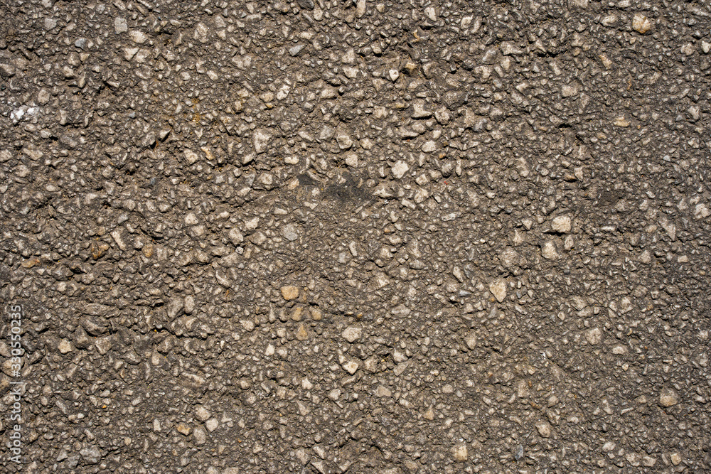 Texture of an asphalt road. Close-up background. Top view. Texture of an asphalt road. Close-up background. Top view.