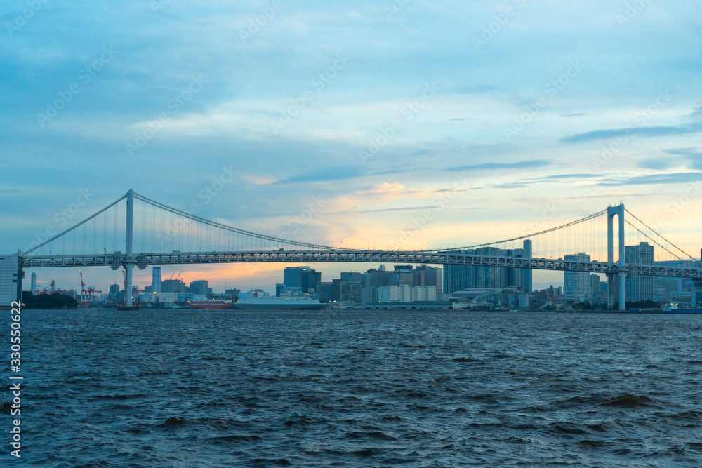 Rainbow bridge eveing in Tokyo city.