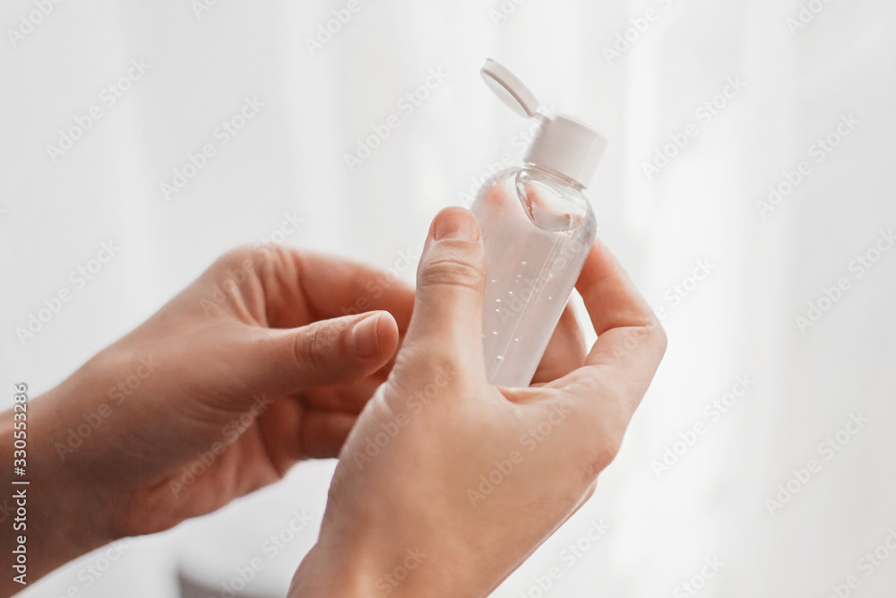 Hands disinfection. Hands with disinfecting alcohol gel and sanitizer bottle, prevent virus epidemic. Prevention of flu disease and coronavirus. Cleaning and disinfecting hands in proper way. - obrazy, fototapety, plakaty 