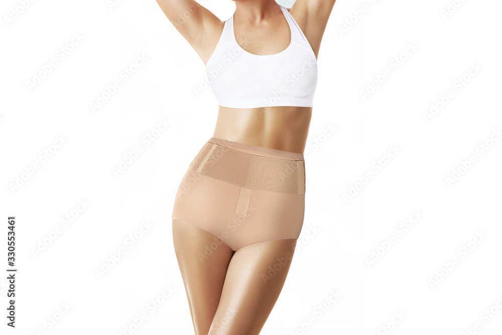 Postnatal Bandage. Medical Compression underwear. Orthopedic bandage  underpants for lowering of the pelvic organs. Postpartum Tummy Control  Belly Bandage. Female Bodyshaper. Postoperative bandage Stock Photo