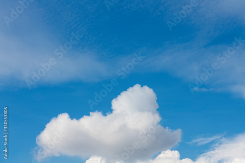 Beautiful blue sky and close-up white clouds.  Nature background .