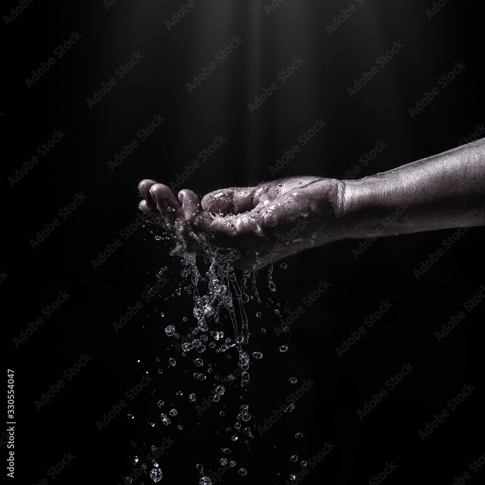 water stream on woman hand,water splashes on the palm