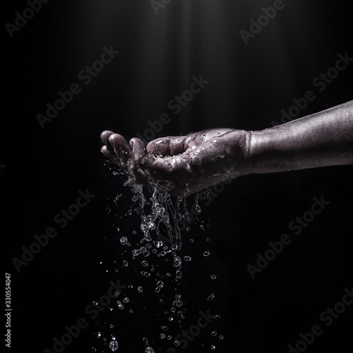water stream on woman hand water splashes on the palm