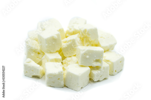 Feta cheese cubes isolated on white background