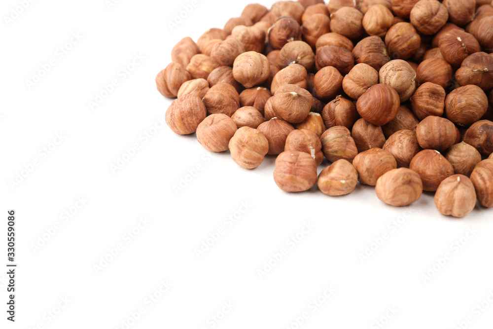 pile of hazelnuts isolated on white background with copy space pile of hazelnuts isolated on white background with copy space