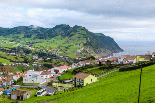 Beautiful coastal village on island with lush green nature © Muskoka