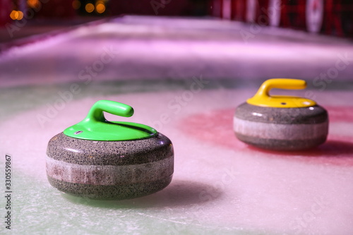 Carta da parati curling stones on ice near the home colorful background