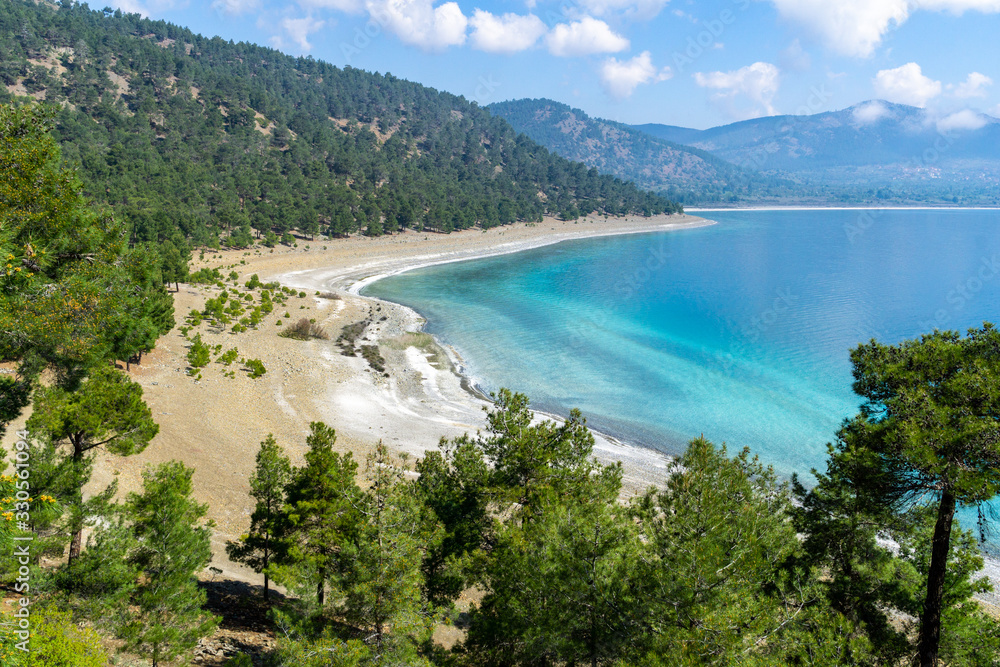 Obraz premium High angle aerial view from the Lake Salda. Lake Salda is a mid-size crater lake in southwestern Turkey, within the boundaries of Yesilova district of Burdur Province.