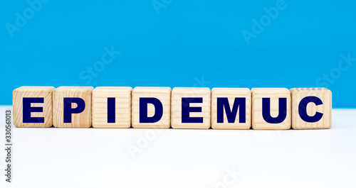 concept word EPIDEMUC on cubes on a blue background